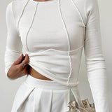 The Clair™ | Langærmet top med ribbet piping